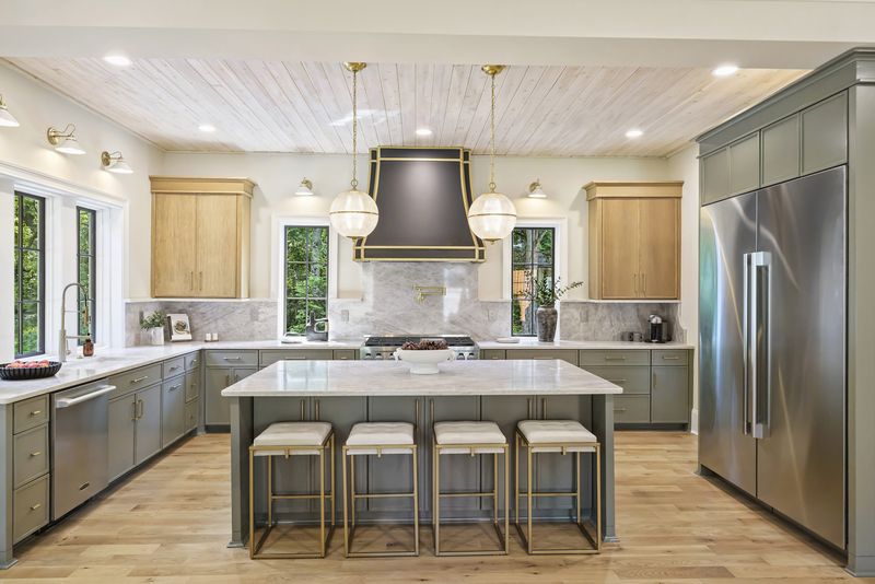 Kitchen with custom hood and island seating